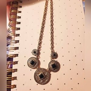 Gold and black necklace